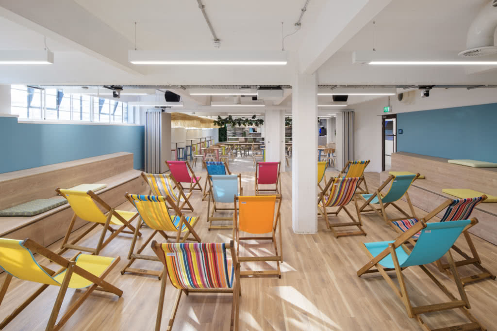 A view of the Sandbox bar area filled full of deck chairs